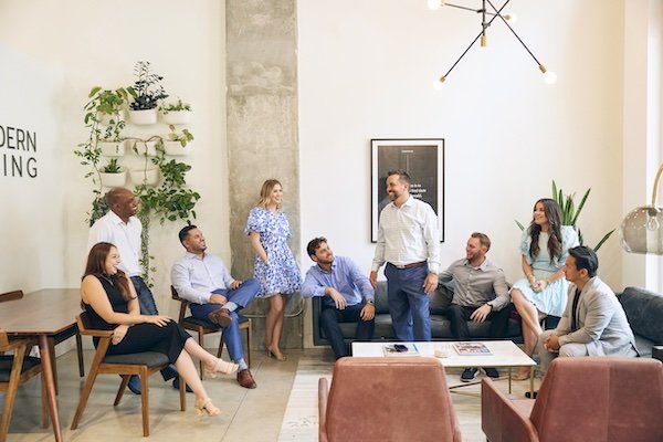 Modern Living Group agents collaborating in the West Palm Beach office at 480 Hibiscus Street